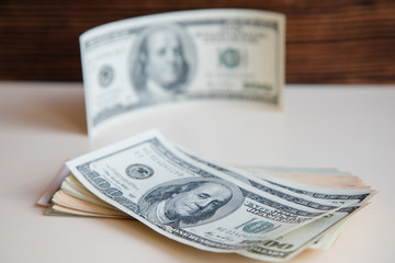 The hundred dollar banknotes as a background