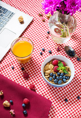 Multigrain wholewheat healthy cereals with fresh berry and a glass of juice for breakfast