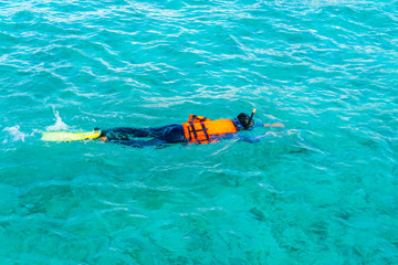 Snorkeling in tropical Maldives island .
