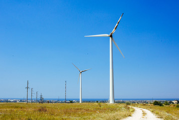 Fototapeta premium Several wind power stations against the sky