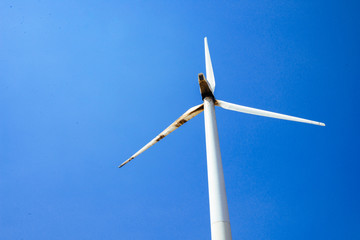 Wind power station against the sky