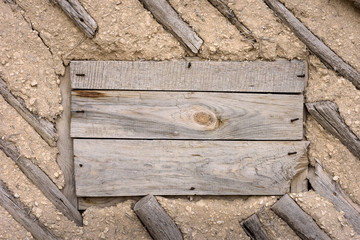Wall of natural wood and clay. Old boards background. Ancient architecture, handmade. Rustic style.