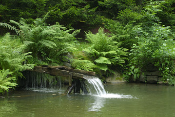 Wooden rural waterfall in countryside.
