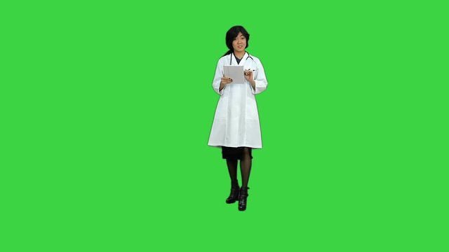 Successful young business woman happy for her on a Green Screen, Chroma Key