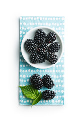 Tasty ripe blackberries in bowl.