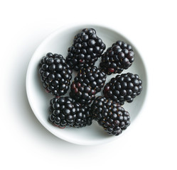 Tasty ripe blackberries in bowl.