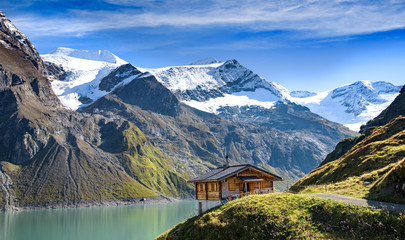 Alpine hut with a great view over an alpine lake and glacier, Kaprun, Salzburger Land, Austria