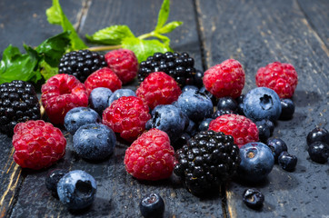 Multicolored forest berries. Water drops.