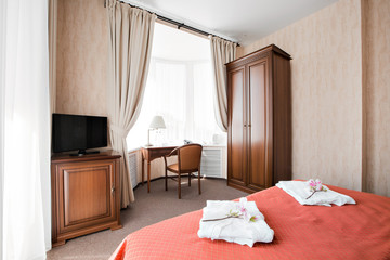 Hotel apartment, bedroom interior in the morning