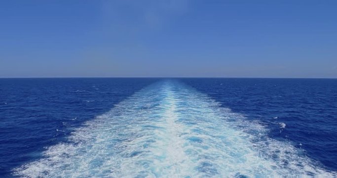 A slow motion view of the wake behind a large cruise ship at sea. Shot at 48fps.  	
