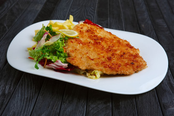 Fried chop pork cutlet with potato and ketchup