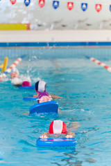 Swimming Kids Lesson with swimming table in a row