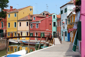 brightly coloured houses and boats on the island of Burano