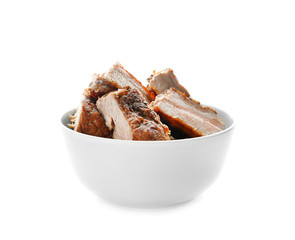 Juicy fried spare ribs in bowl, isolated on white