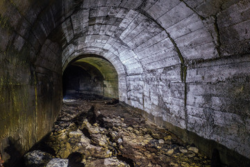 Abandoned bunker tunnel with concrete walls 
