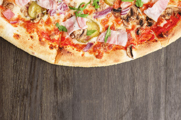 Pizza with ham and arugula. Top view