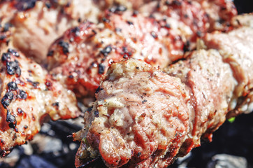 Barbeque meat with charcoal close up