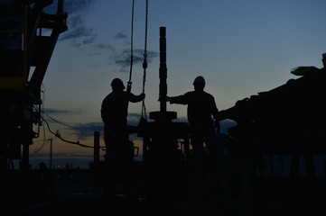 field oil workers at work