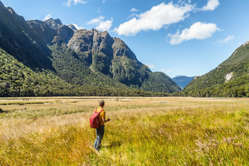 Fototapeta na wymiar New Zealand tramping hiker man walking at Routeburn Track, Fiordland National Park at Te Anau. Travel destination for hiking.