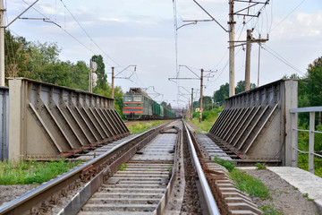 Obraz premium Railroad bridge crossing over another railway below. Ukraine.