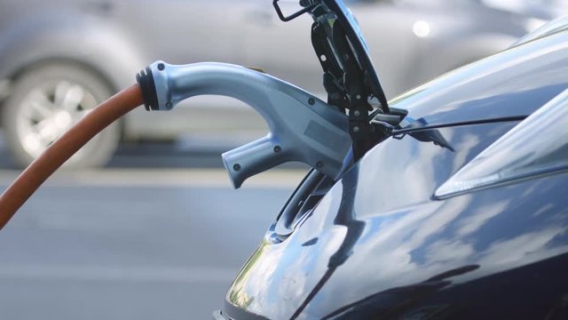 Plug in electric vehicle charging cord connector to ev socket