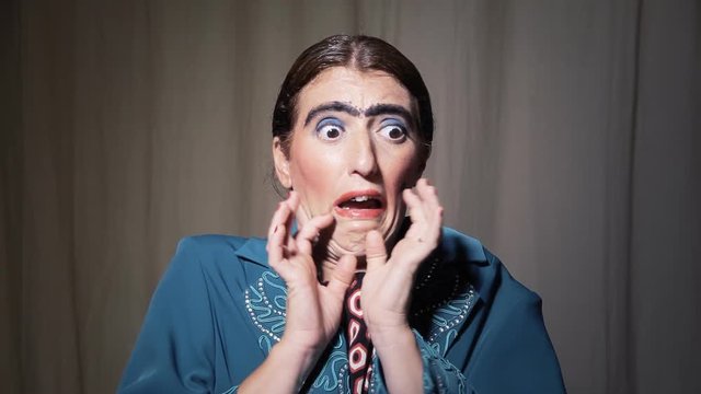 The scared face of a funny ugly woman. Comedy shot.
