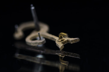 Watch Repair: Antique Metallic Pin Pallet Shining in the Darkness