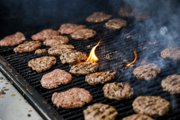 BBQ meat patties beef veal on the grill cooking outdoors smoke flame fire charcoal kebab 