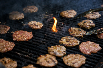 BBQ meat patties burgers on the grill cooking chicken beef veal  flame fire 