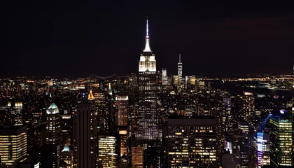 Photo sur Plexiglas Empire State Building The Empire State Building, One World Trade Center, and the skyline of downtown Manhattan at night. 