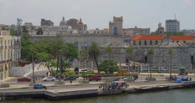A high angle day dolly establishing shot of the shoreline of Havana, Cuba. Shot at 48fps.  	