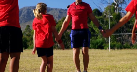 Trainer training kids in the boot camp