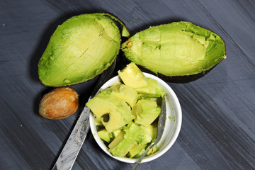 Avocado on wooden background