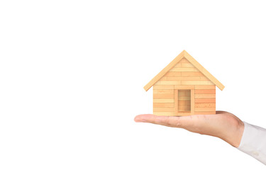 Obraz na płótnie Canvas Mortgage concept by house from hand