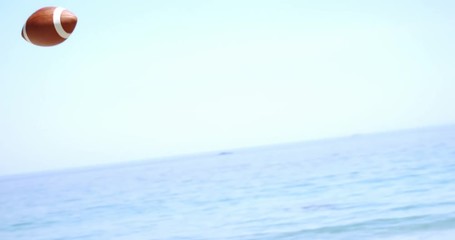 Friends playing rugby at beach - Powered by Adobe