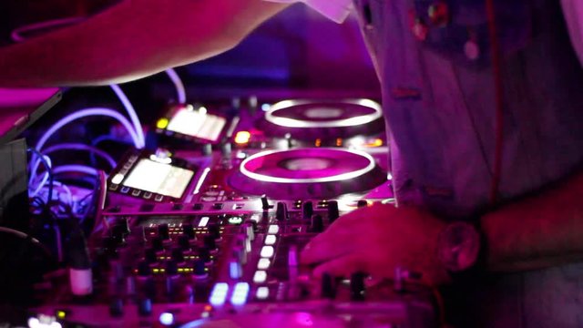 DJ Spinning at Night Club