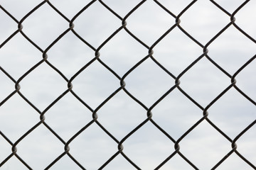 Lovely Clouds through Chainlink The clouds are too lovely to be stuck behind this chainlink fence today! They do look a lot more interesting this way, though. Great for a fence effect.