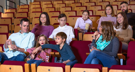 Number of people enjoying film screening and popcorn