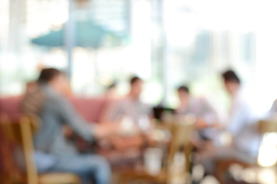 Blurred background - people sitting in coffee shop