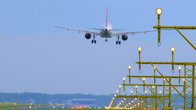Spectacular airport approach - aircraft landing on the runway
