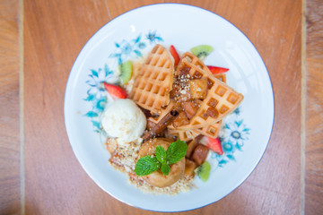 waffle with vanilla ice cream and apple