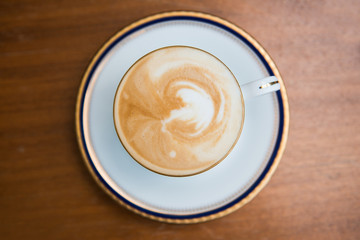 cup of mocha with milk foam in,cafe.