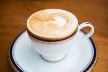 cup of mocha with milk foam in,cafe.