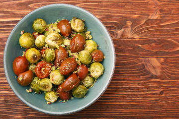 Oven baked brussels sprouts and tomatoes with pistachios