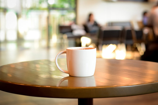 Coffee cup on the table in coffee shop