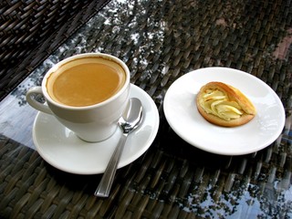 A Cup of Americano and sochnik in a cafe on the terrace.
