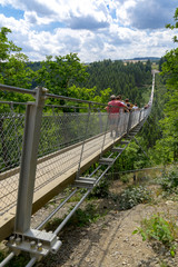Fototapeta premium Moersdorf, Rhineland-Palatinate/ Germany July 18 2017: Germany's largest suspension bridge Geierlay in Moersdorf at Hunsrueck mountains