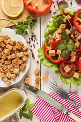 Caesar salad on rustic background