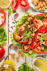 Caesar salad on rustic background. Top view