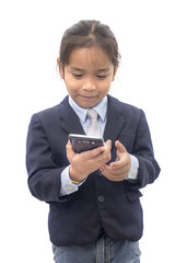 Fototapeta premium Asian boy in suit dial on mobile phone over white background